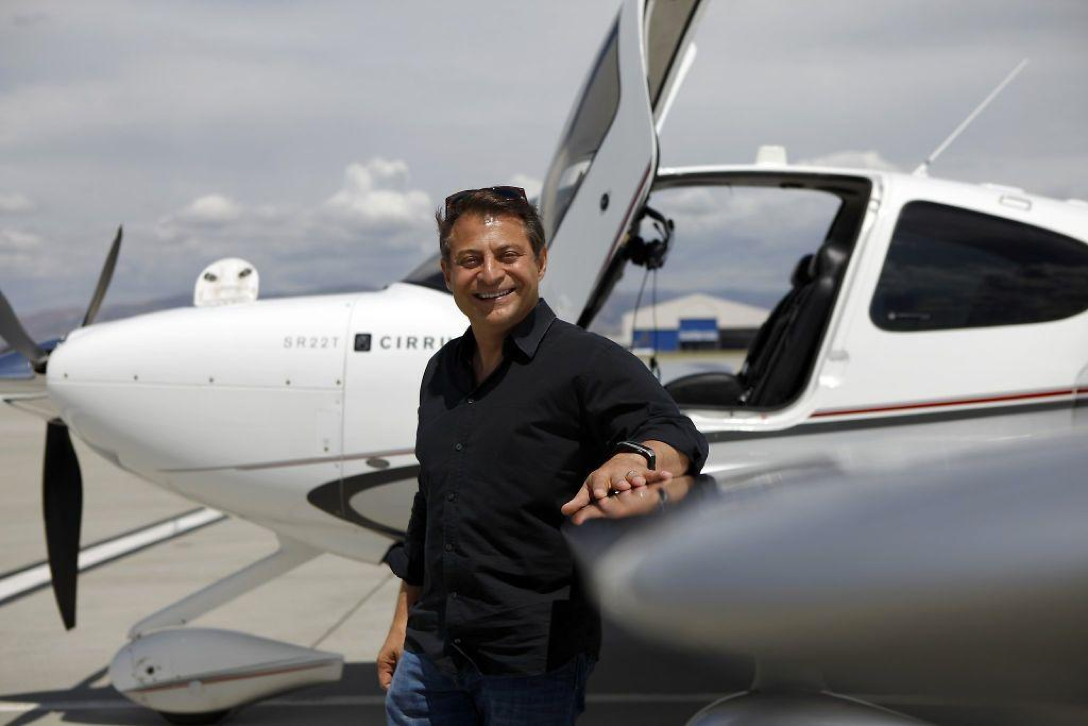 Peter Diamandis standing in front of a plane.